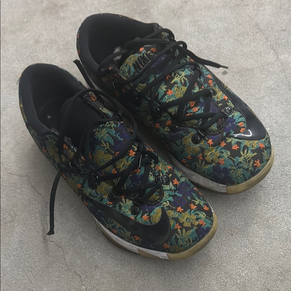 Nike Black and Green Sneakers with Flexible Upper and Rounded Toe